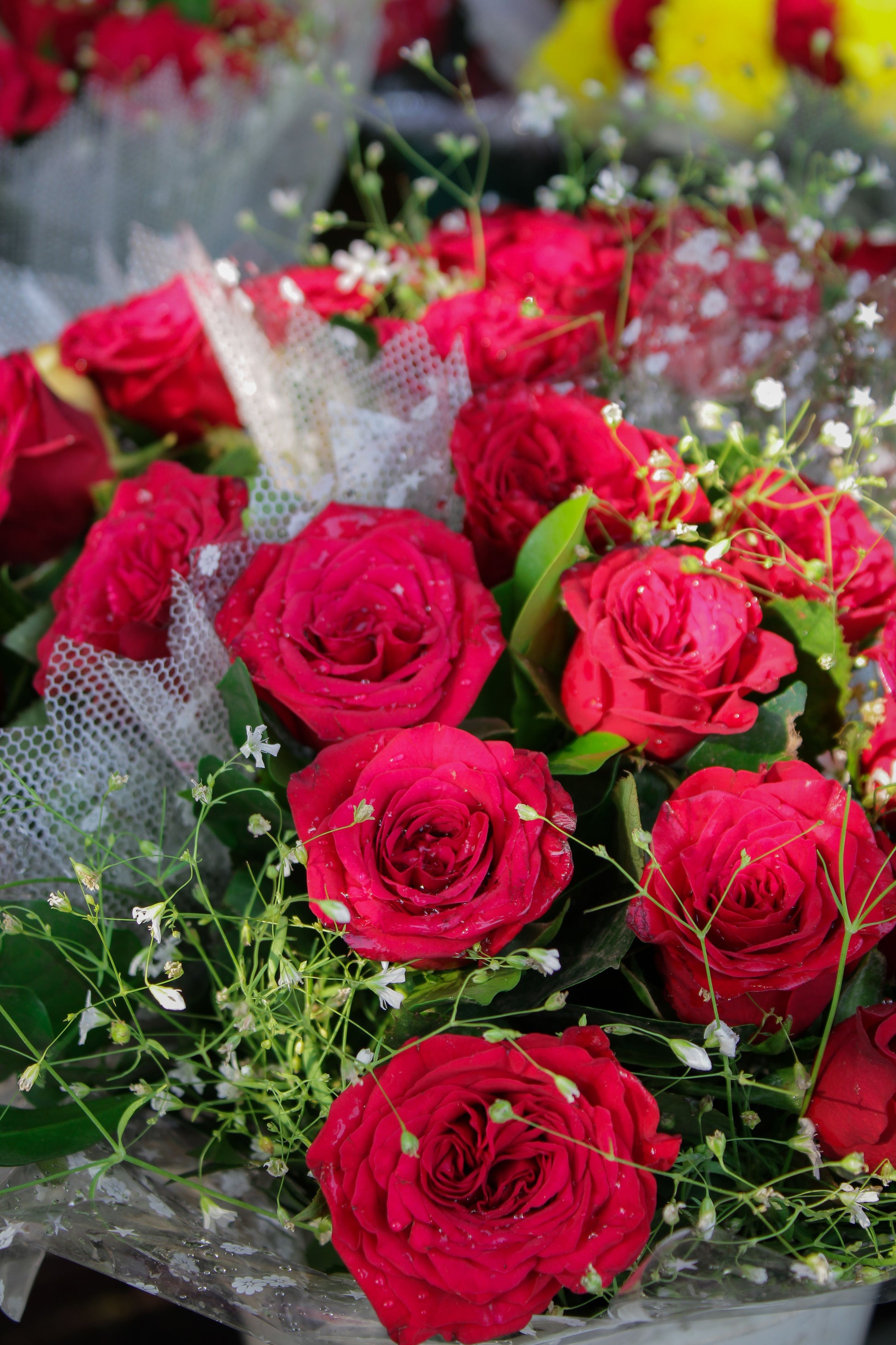 Bouquet of vibrant red roses with delicate greenery — Classic Red Roses by Local Flower Girl