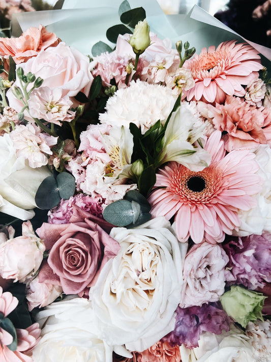 Soft pastel flower arrangement in gentle pinks and creams — Sweet Welcome Baby Bouquet by Local Flower Girl